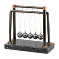 Pendule de Newton 30 cm en métal noir et cuivre décoratif de bureau