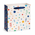 Sac cadeau 32 x 26 x 12 cm en papier blanc à motifs multicolores avec poignées ruban festif