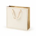 Sac cadeau 30 x 12 x 35 cm en papier ivoire à anses ruban style élégant